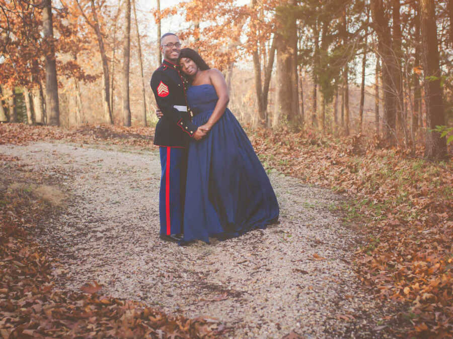 marine and wife in blue dress outside