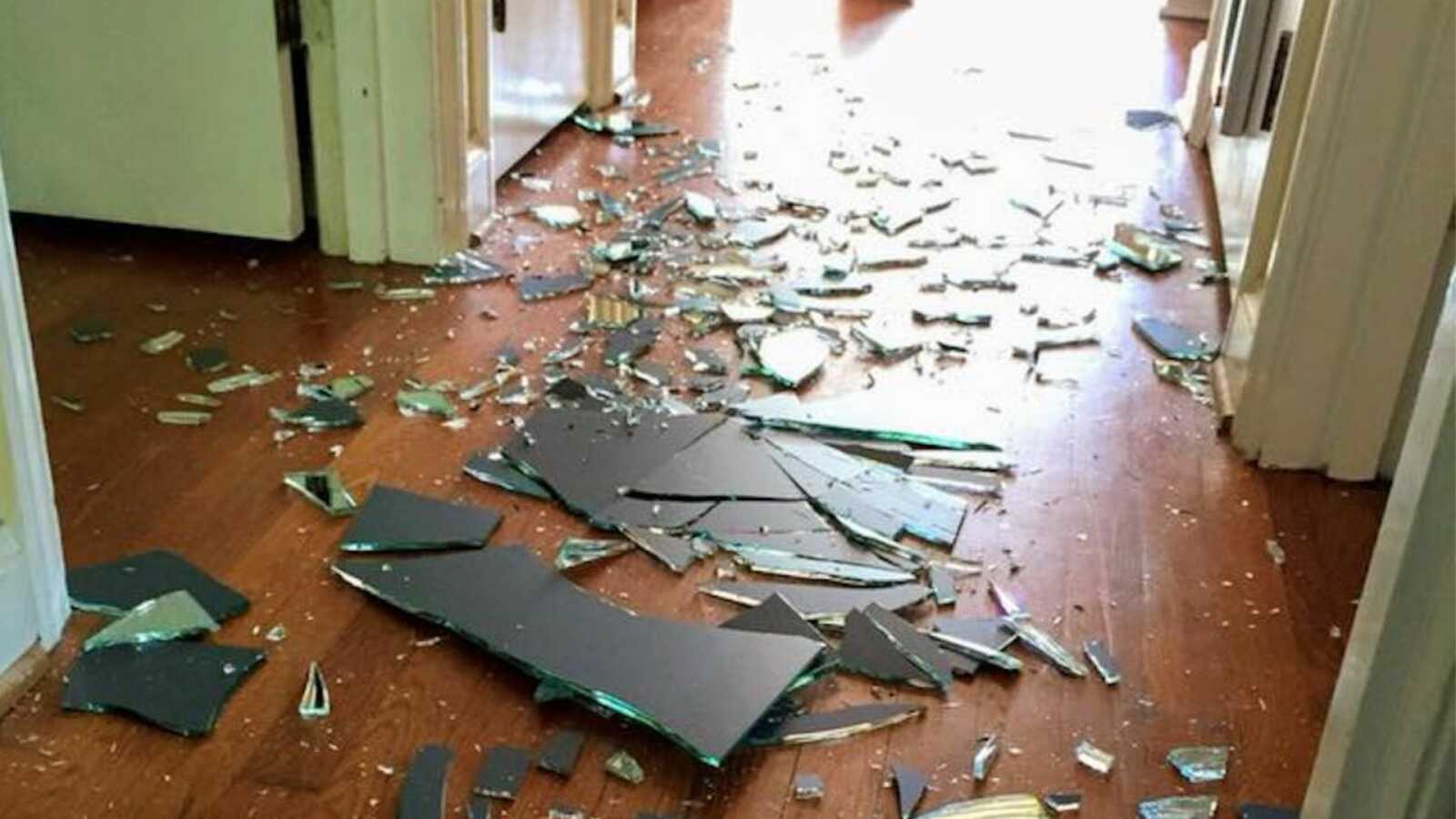 broken mirror shattered on floor