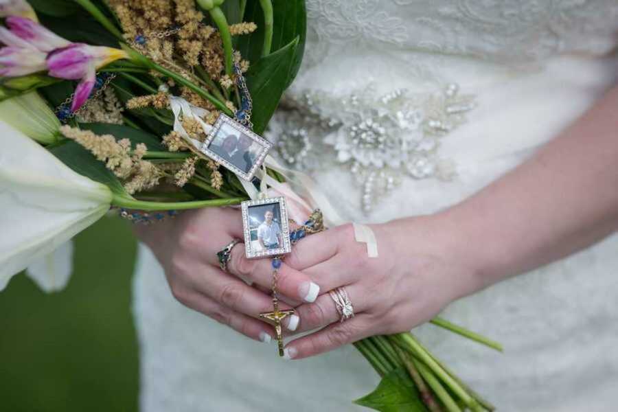 bride holding flowers with images of late son attached