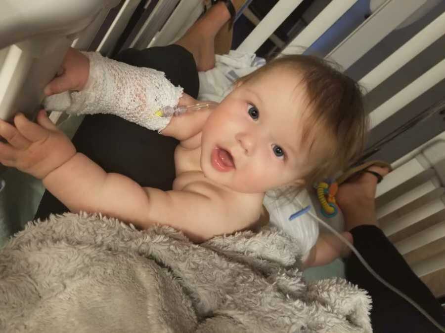 toddler in hospital crib