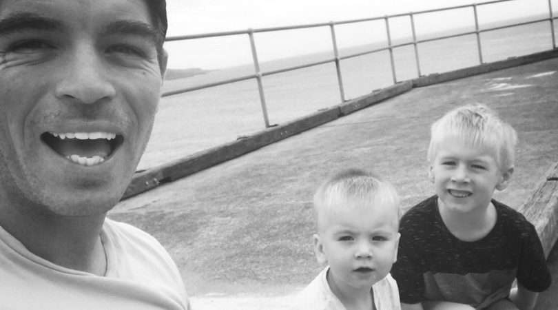 black and white selfie of dad with two young sons