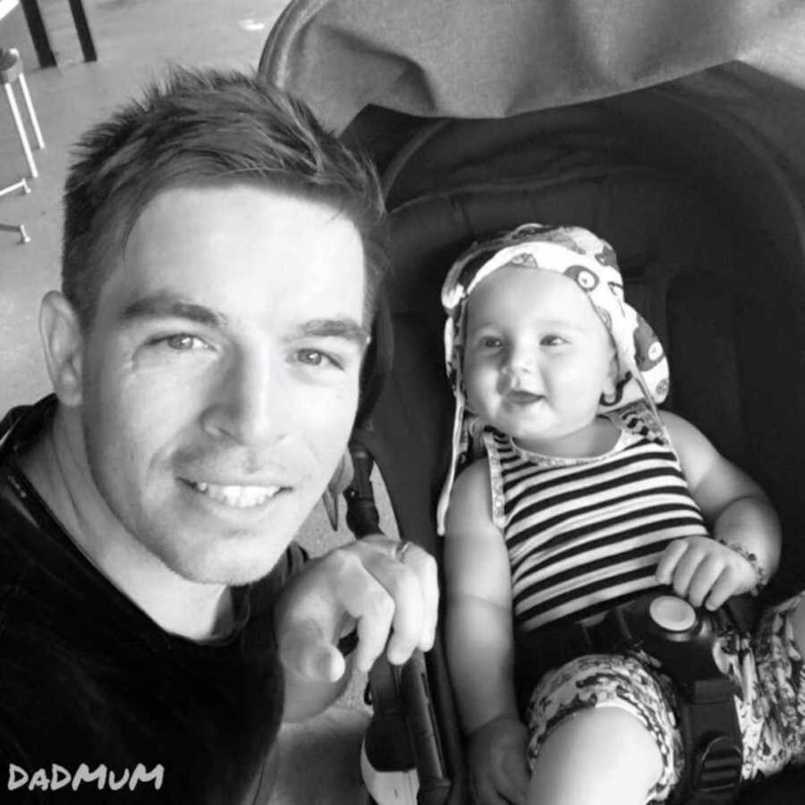 black and white selfie of dad with baby in stroller