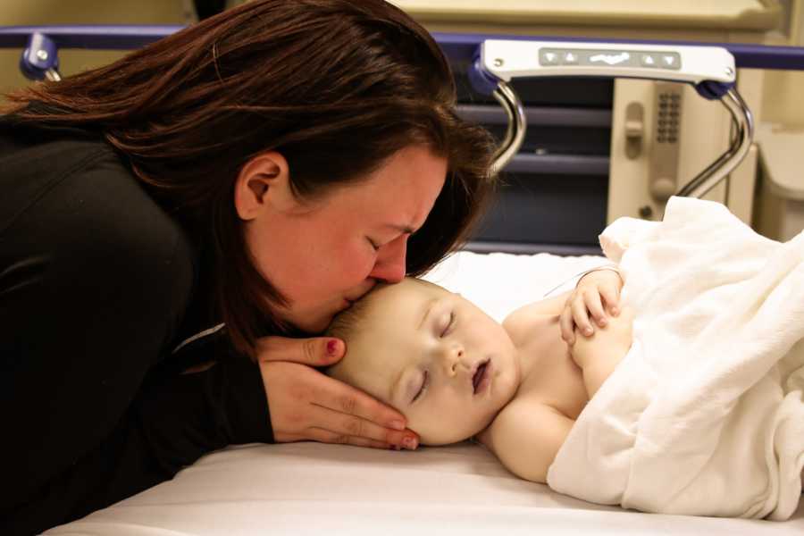 Mother who lost her child to SIDS holds cupcake in her hands for deceased son