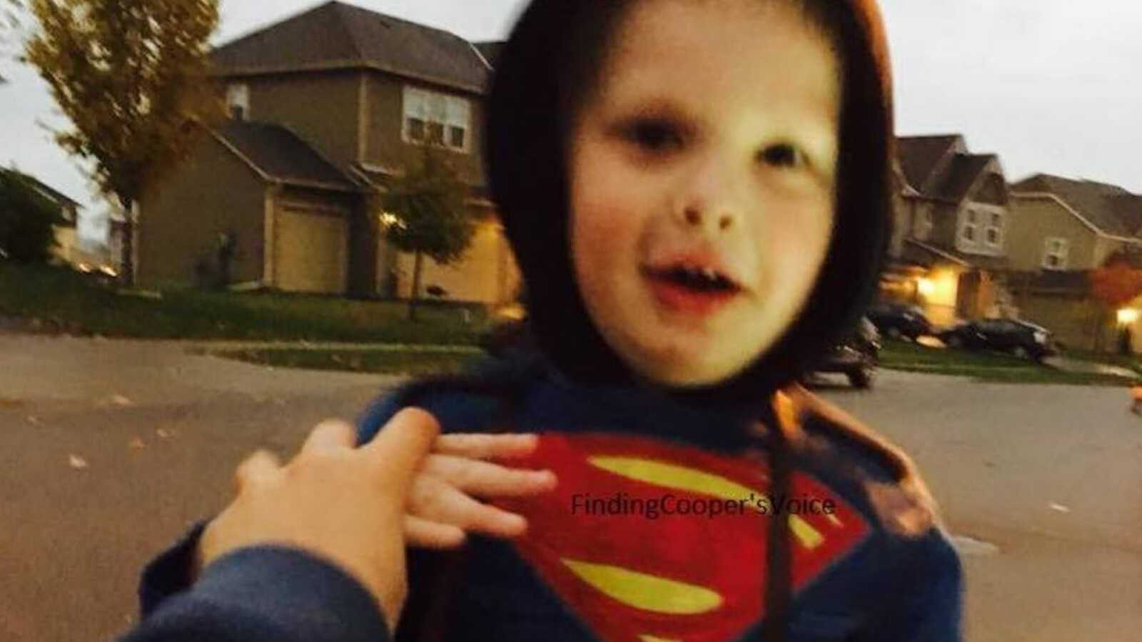 boy with Autism in superman costume on halloween