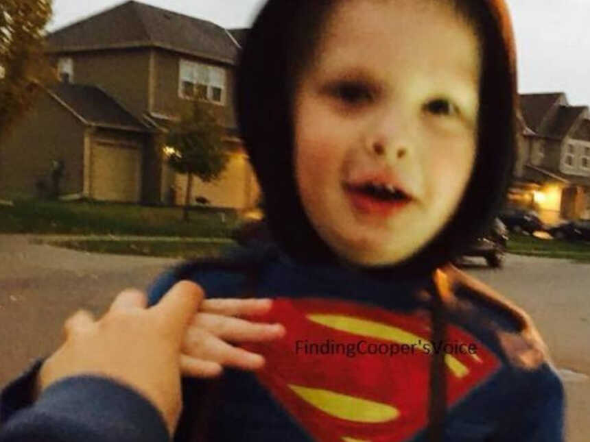 boy with Autism in superman costume on halloween