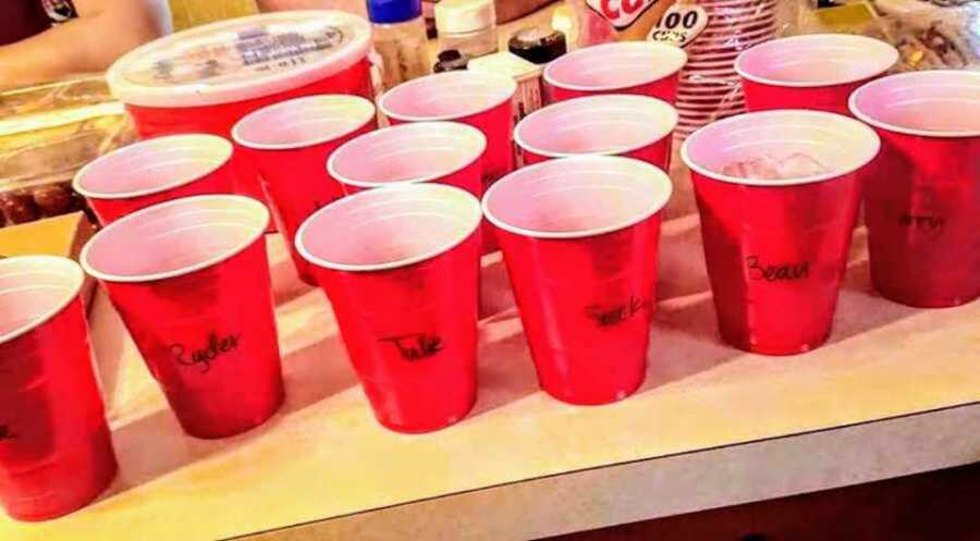 red solo cups labeled with names