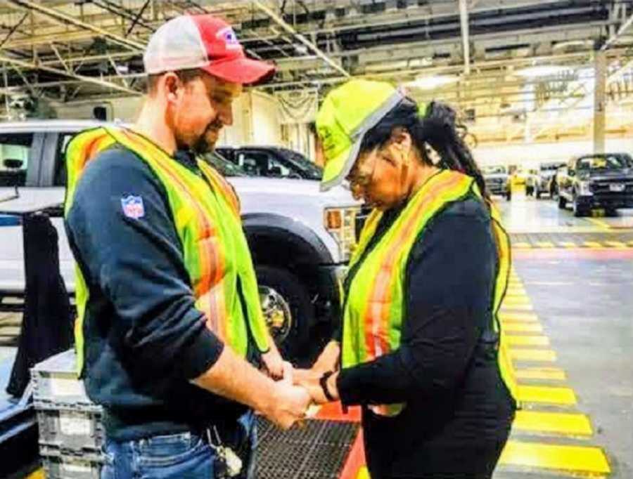 man and woman holding hands and praying