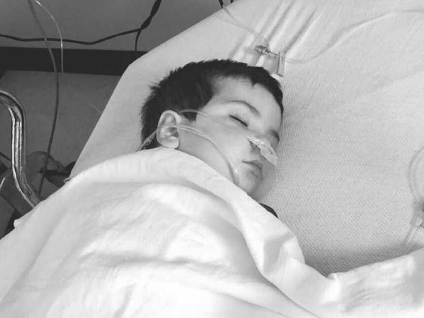 boy asleep in hospital bed