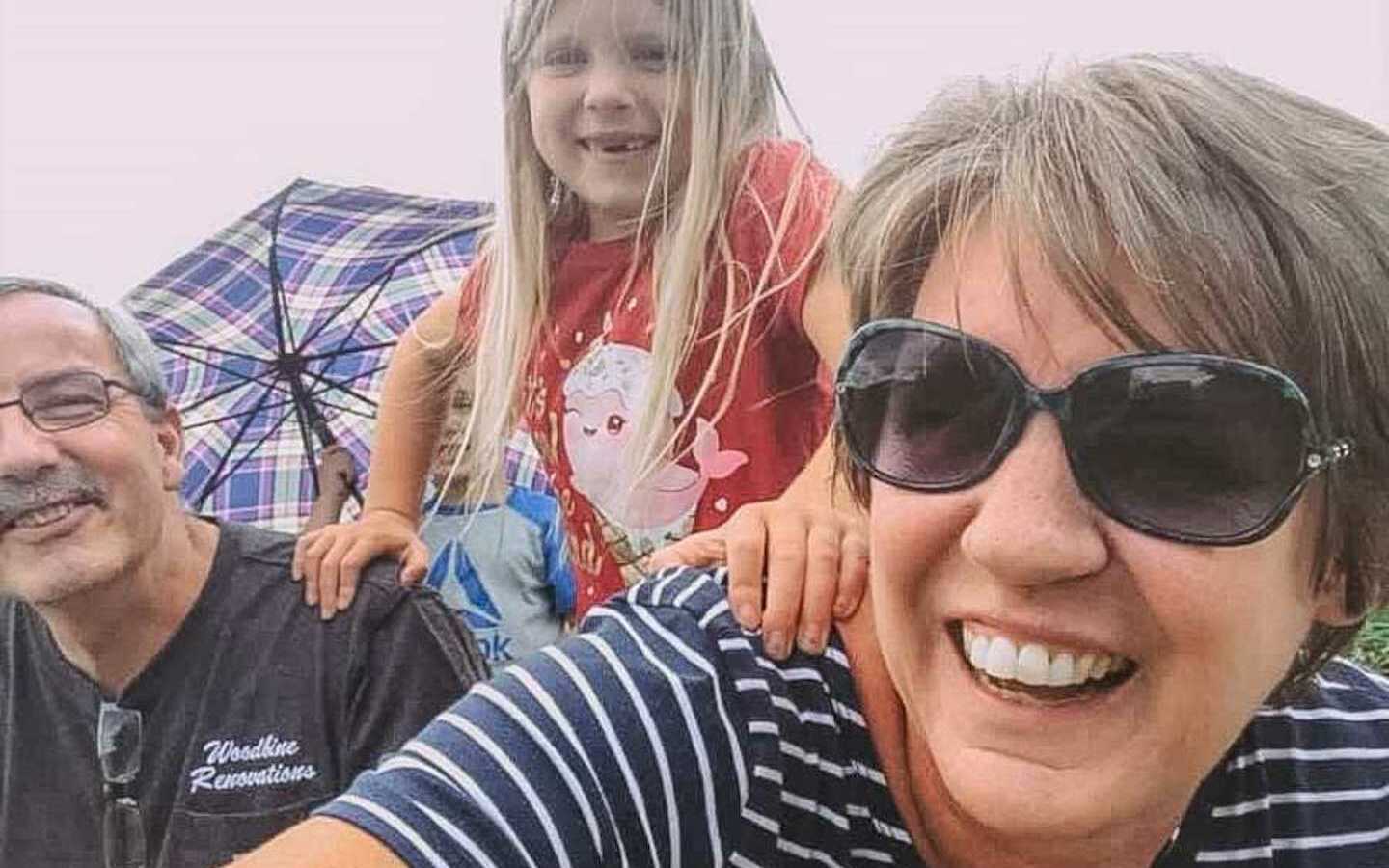 grandparents and kids smiling in selfie 