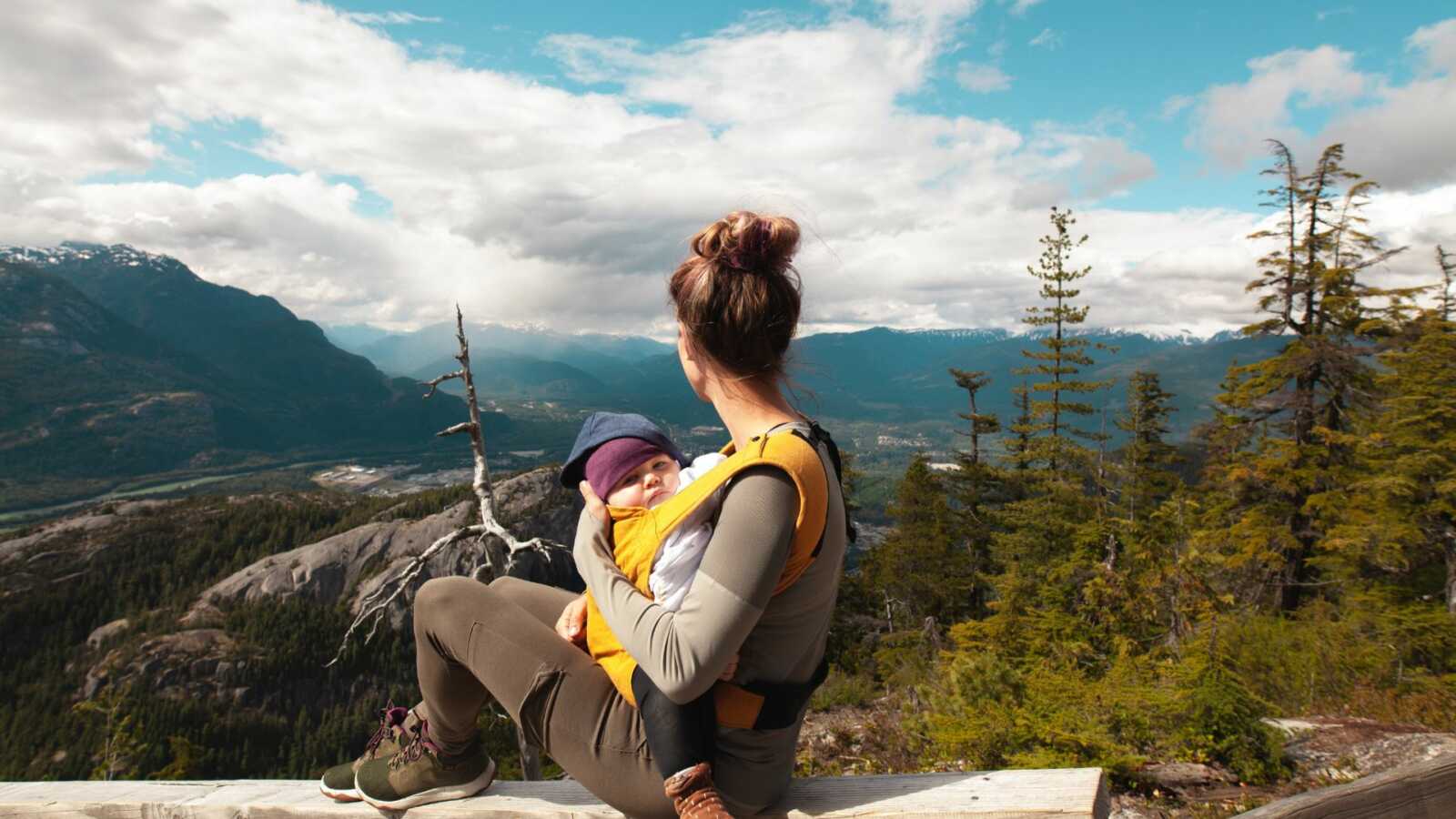 mom baby wearing in nature