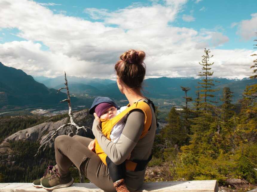 mom baby wearing in nature