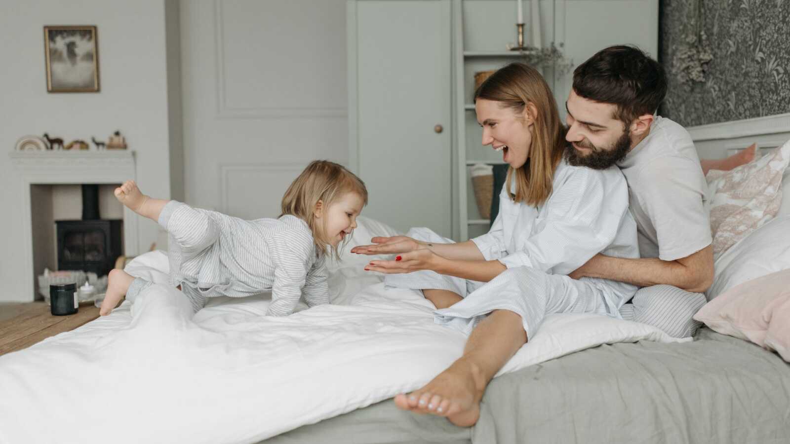 mom and dad with toddler daughter