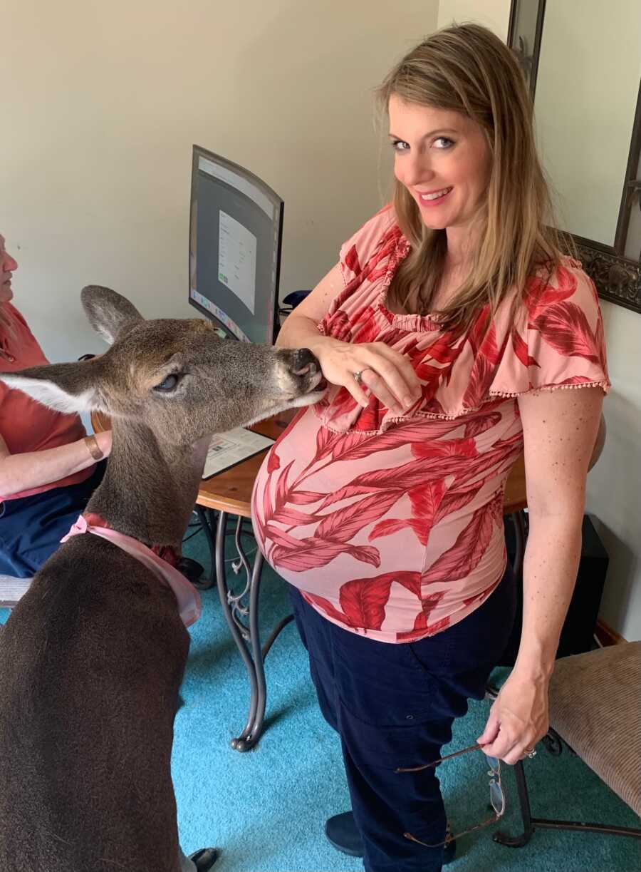 Pregnant woman in red floral shirt