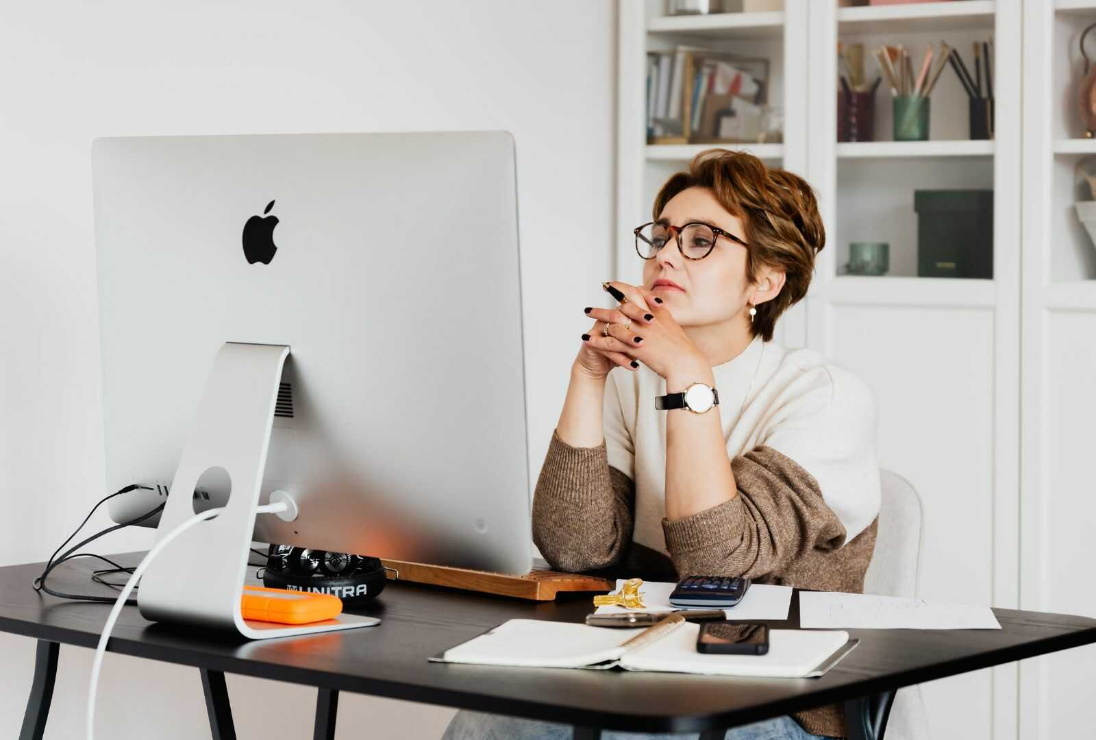 woman looking at computer thoughtfully
