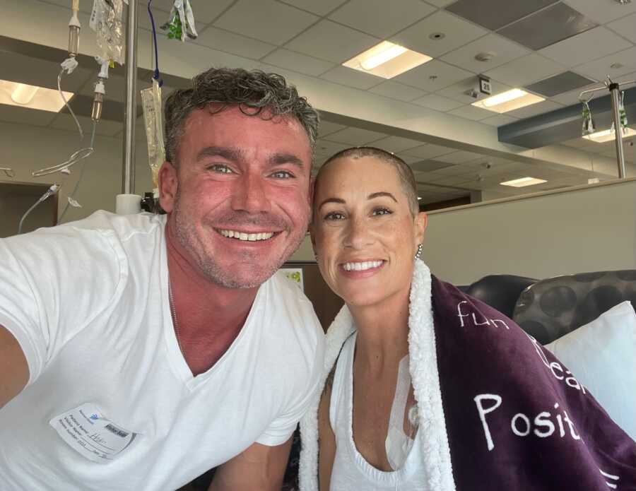 Boyfriend and girlfriend smiling in cancer treatment wing