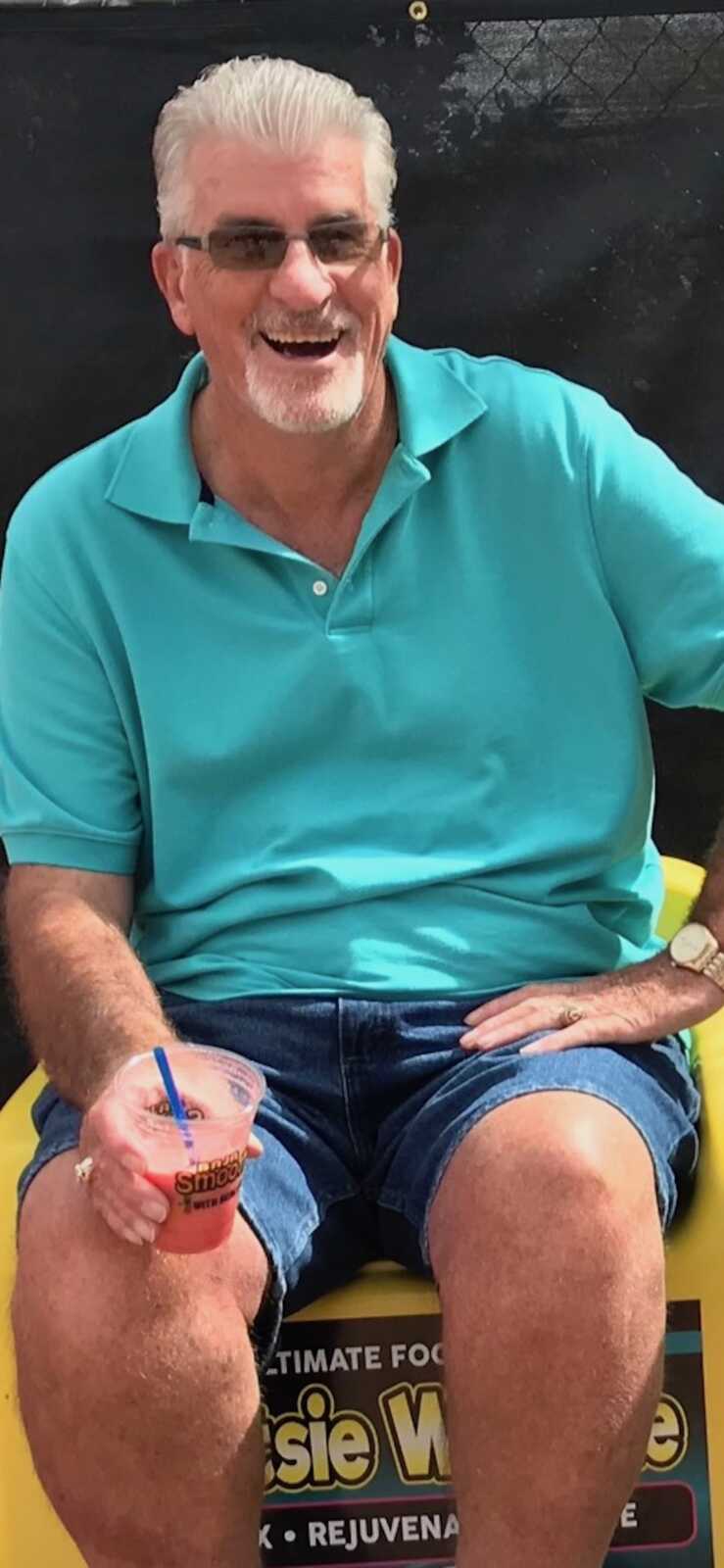 Dad in blue shirt smiling