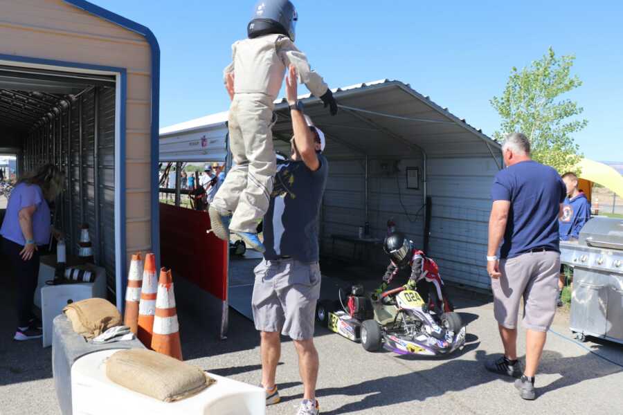 Dad playfully throwing boy in the air