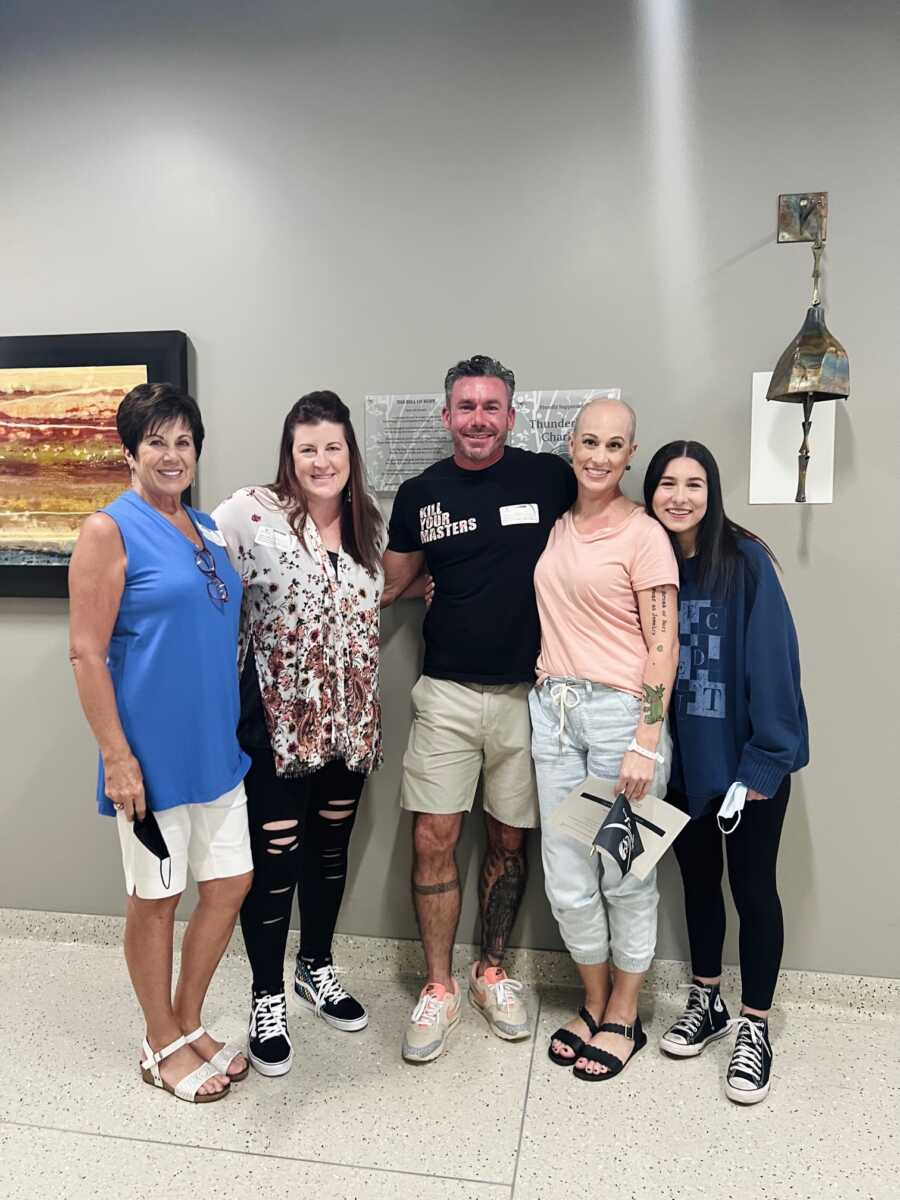 Family standing in hospital lobby