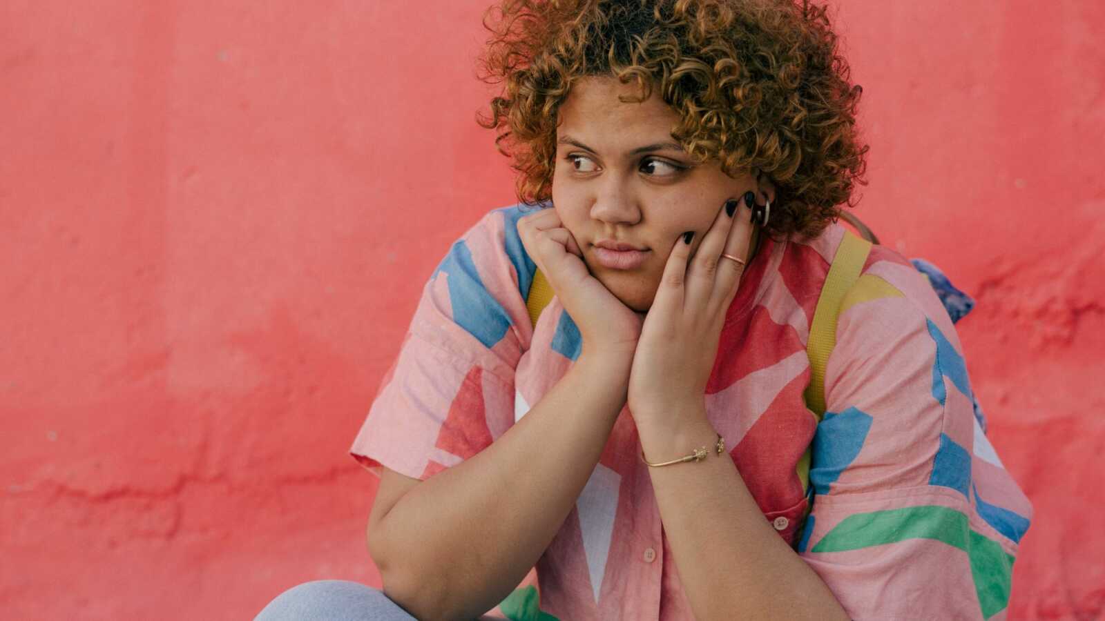 unhappy woman gazing off camera