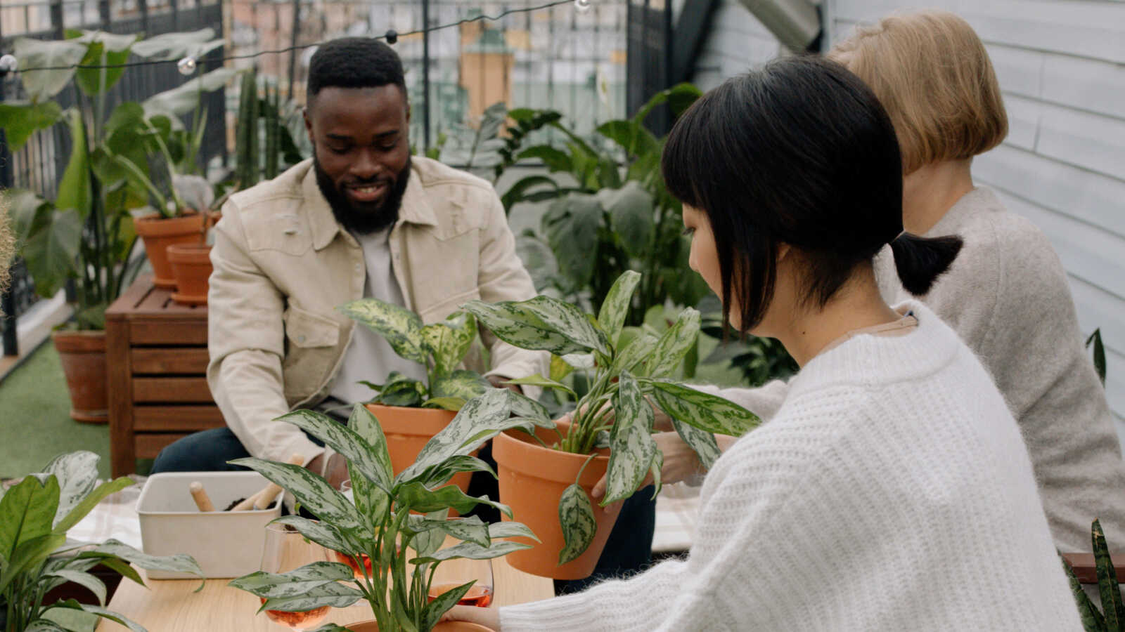 a group of people in a gardening workshop