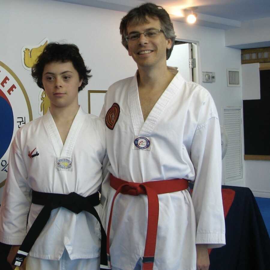 Dad and son wearing karate uniforms